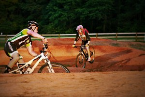 The Sokol Park Pump Track, a series of red dirt hills, is designed so that the biker can bounce along the hills without having to pedal.